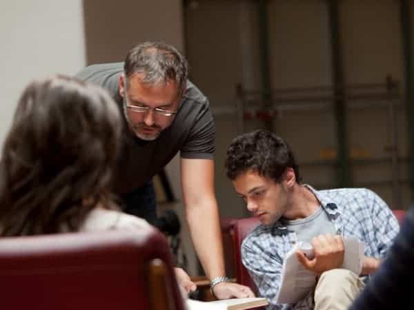 teacher helping students