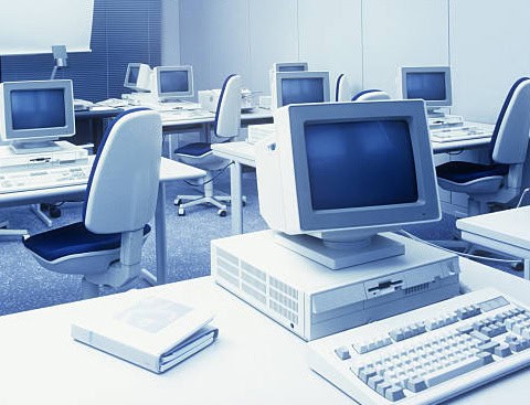 An old-fashioned computer lab with CRT monitors